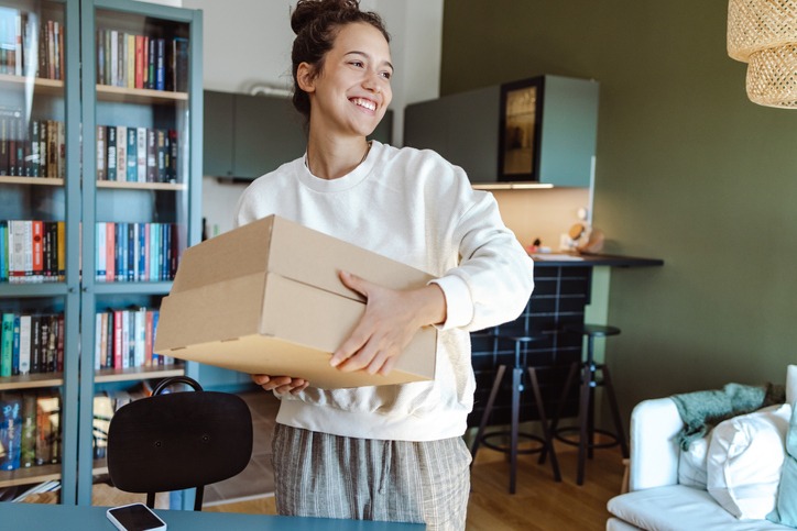 subscription box | MemberPress Young woman with a subscription box